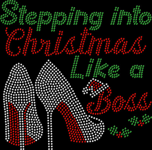 Stepping into Christmas Like a Boss rhinestone shirt featuring sparkling crystal lettering on a soft women’s tee, perfect for Christmas parties, holiday outings, and festive fun.