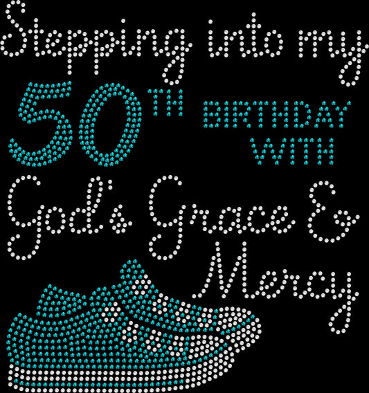 Stepping Into My 50th Birthday rhinestone shirt featuring tennis shoe design with God’s Grace and Mercy wording and sparkling crystal lettering on a soft t-shirt