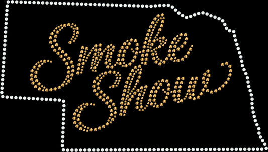 Nebraska Smoke Show rhinestone shirt featuring sparkling crystal lettering inside the outline of the State of Nebraska on a soft women’s tee, perfect for state pride, game days, and bold sparkly fashion.