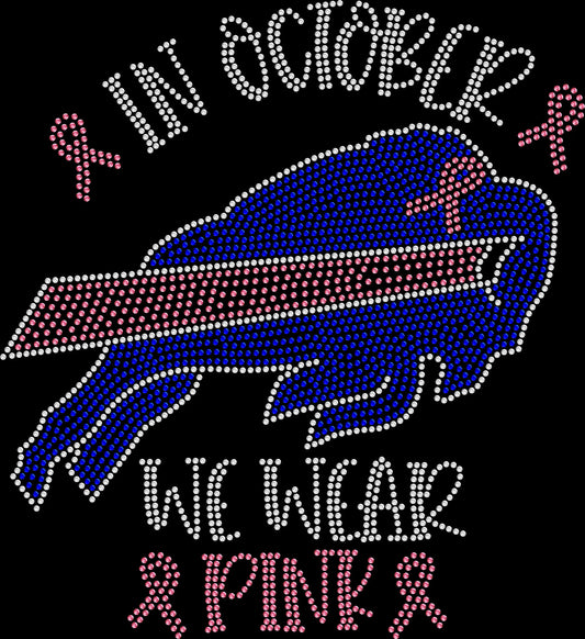 In October We Wear Pink football-inspired shirt featuring pink breast cancer awareness ribbons created with premium glass rhinestones or holographic spangles. Ideal for football season, Pink Out games, awareness walks, fundraisers, survivor support, October events, and spreading hope while showing your support. 🎀🏈💖✨