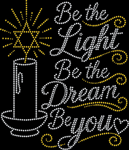 Be the Light Be the Dream Be You rhinestone shirt featuring a single candle with a Star of David incorporated into the flame for Hanukkah, Jewish celebrations, Festival of Lights gatherings, community events and inspirational everyday wear.